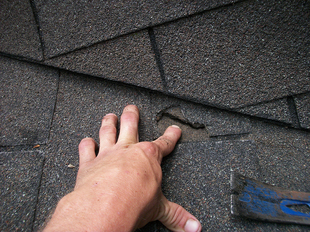 professional roofing company ohio showing multiple layers of shingles