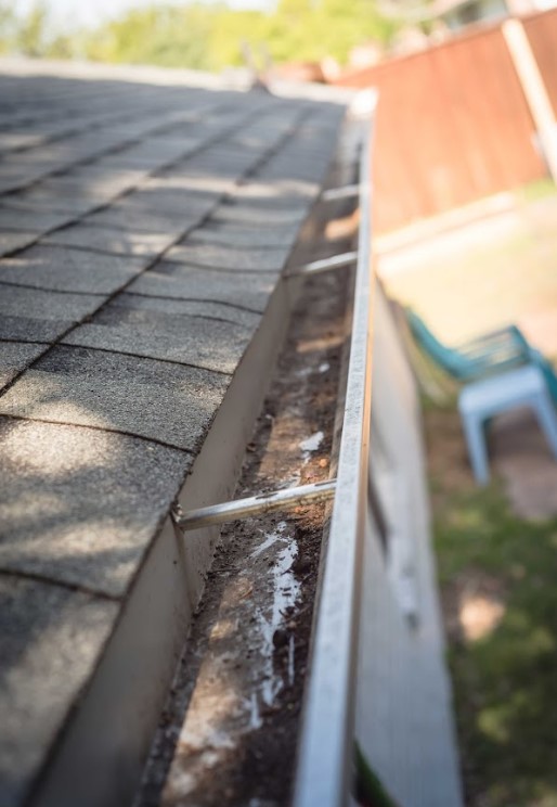 clean gutters to prevent ice dams on roofs